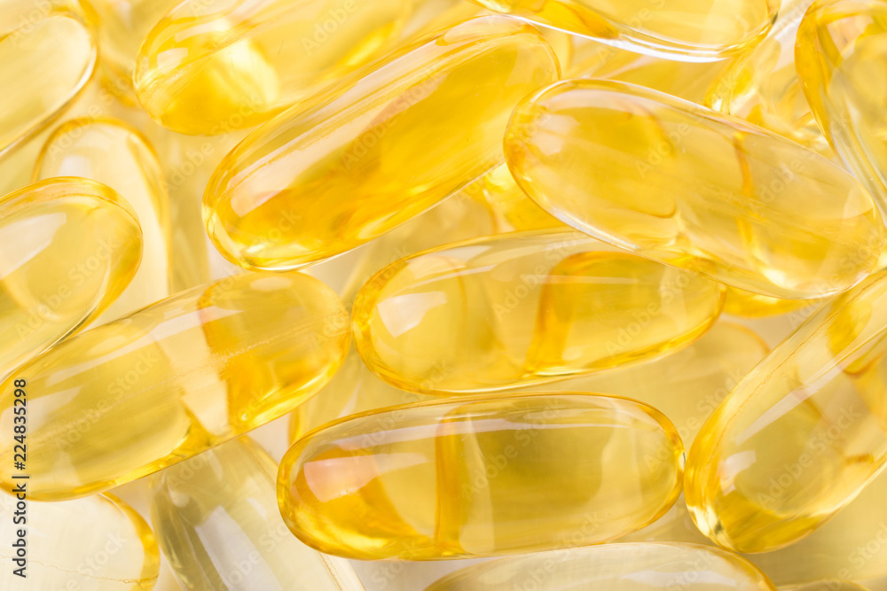 Close up of capsules Omega 3 on white background. Top view, Health care concept Close up of capsules Omega 3 on white background. Top view, Health care concept