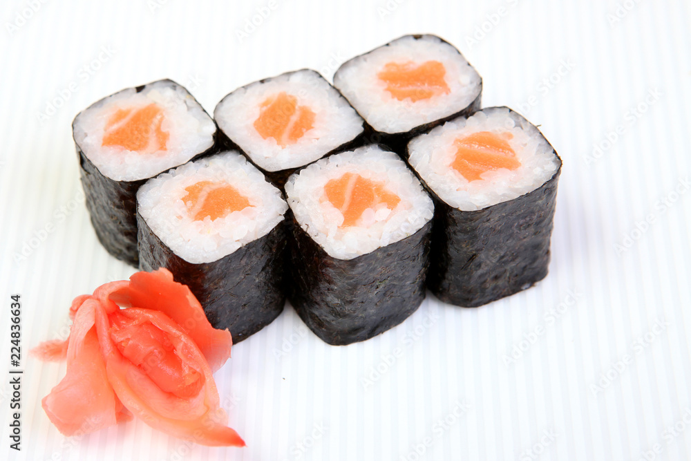 Rolls of Syak maki. Japanese food on a beautiful dish. Dietary food. An exquisite Japanese dish. Fresh dish of fish. Rolls of Syak maki. Japanese food on a beautiful dish. Dietary food. An exquisite Japanese dish. Fresh dish of fish.