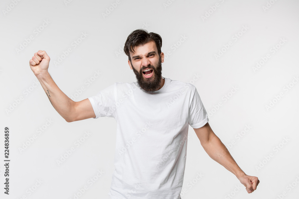 I won. Winning success happy man celebrating being a winner. Dynamic image of caucasian male model on white studio background. Victory, delight concept. Human facial emotions concept. I won. Winning success happy man celebrating being a winner. Dynamic image of caucasian male model on white studio background. Victory, delight concept. Human facial emotions concept.