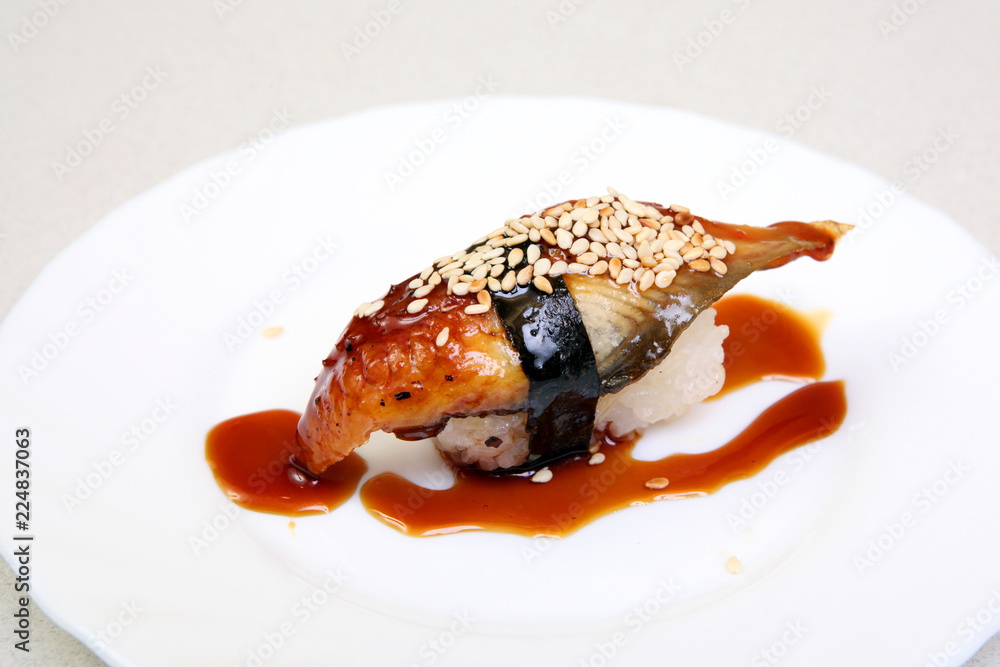 Smoked eel with gravy and cucumber. Sashimi Unagi. Japanese food on a beautiful dish. Dietary food. An exquisite Japanese dish. Smoked eel with gravy and cucumber. Sashimi Unagi. Japanese food on a beautiful dish. Dietary food. An exquisite Japanese dish.