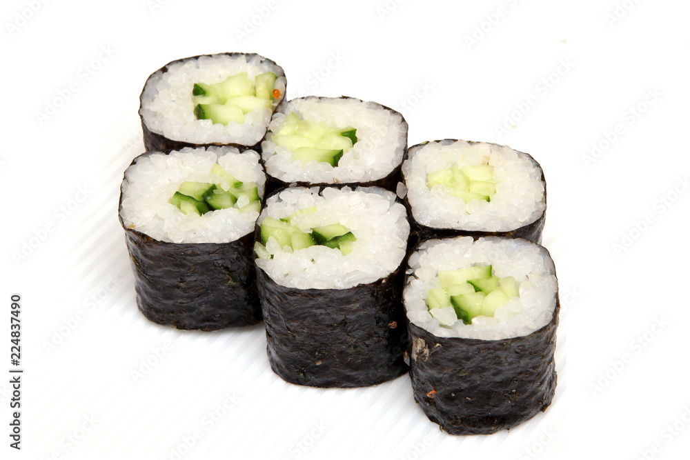 Roll with cucumber. Vegetarian food. Sushi in the nori. Japanese food on a beautiful dish. Roll with cucumber. Vegetarian food. Sushi in the nori. Japanese food on a beautiful dish.