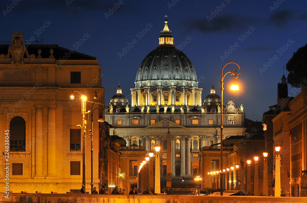 The Papal Basilica of St. Peter at dusk in the Vatican, Italy.