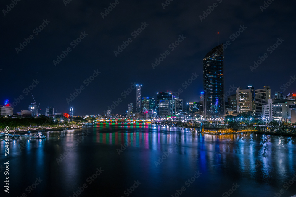 River at cloudless night in city