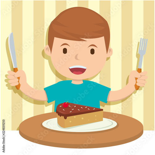A happy boy slicing cake for dinner