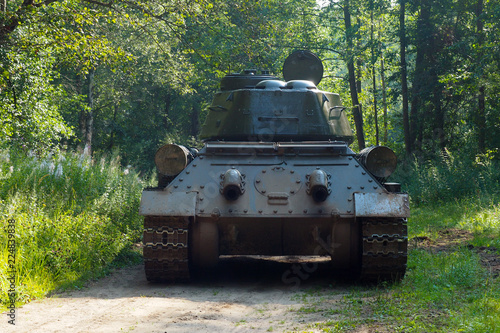 Russian rare tank of world war II in the forest. The legendary retro shooting military tracked vehicles.