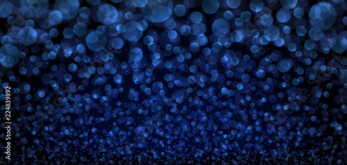 Blue abstract blurred background with bokeh effect.