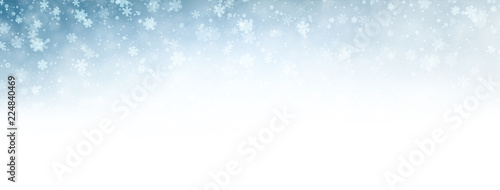 Blue blurred winter banner with snow pattern.