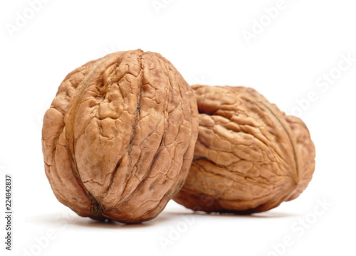 Pair of organic walnuts isolated on white background