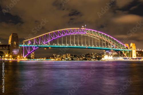 Sydney Harbour bridge night lights reflected on harbour © jmimages