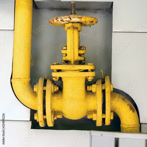 Old gas pipe valve to control gases entering the system. For instagram format, square.