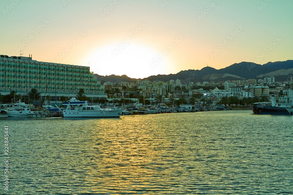 View of Eilat Bay with yachts, at sunset. September 2018.