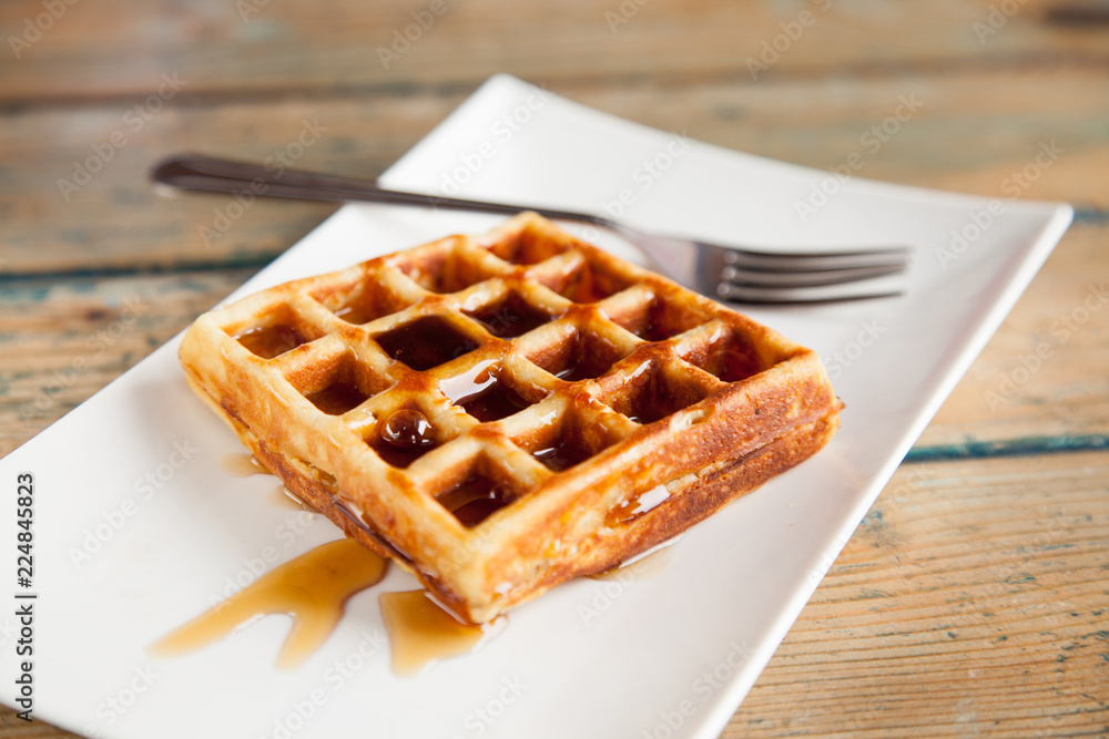 Maple syrup waffle with fork Maple syrup waffle with fork