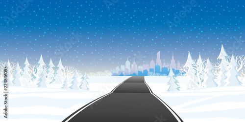 Winter landscape with forest and road to the city.