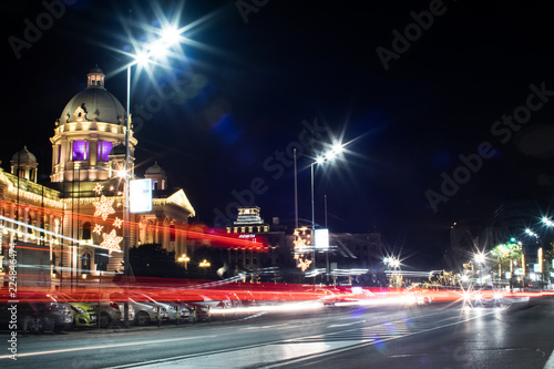 A beautiful night photo of a square in Belgrade. Cars passing. Long exposure.. Dome of National Assembly.