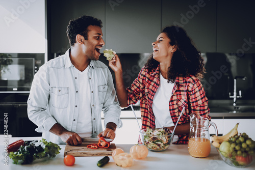 Afro American Couple Cooking At Kitchen Concept. photo