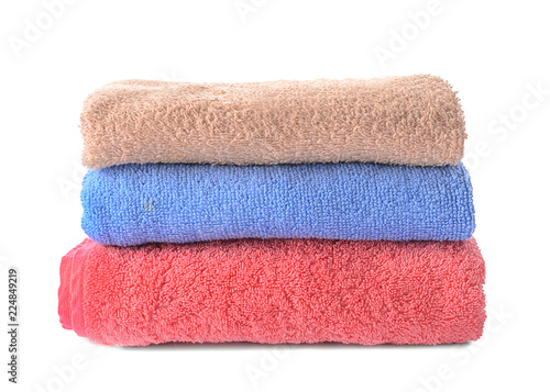 Stack of clean towels on white background