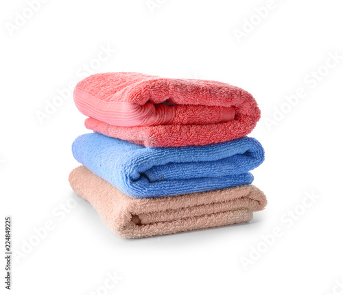 Stack of clean towels on white background