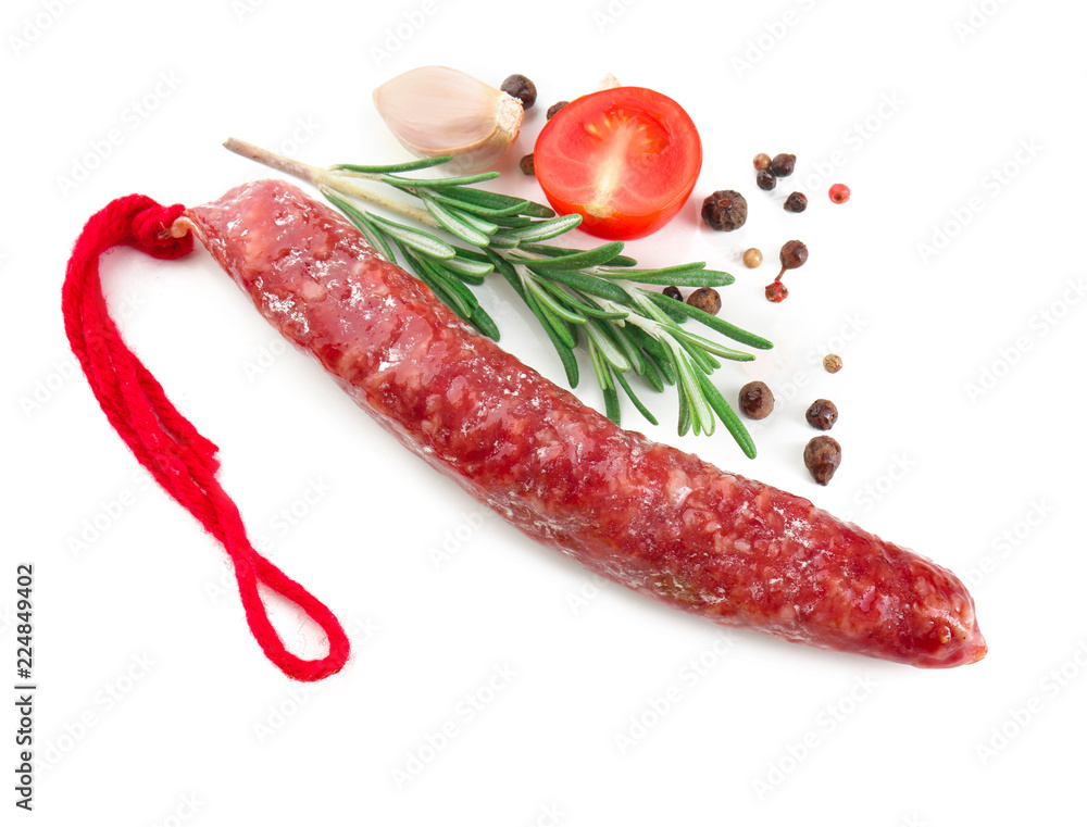 Composition with smoked sausage on white background