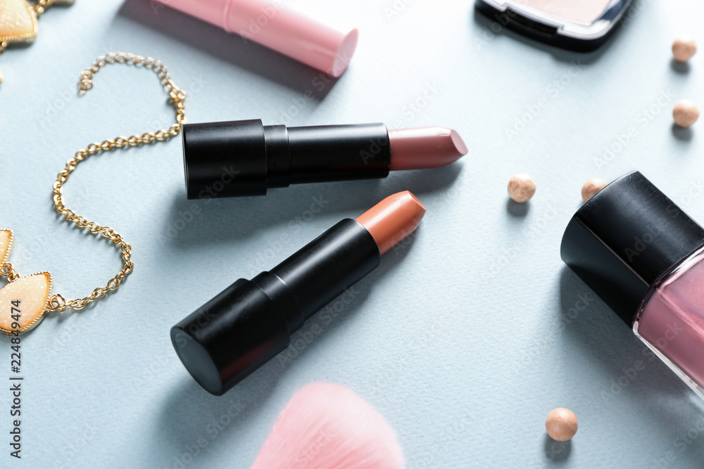 Obraz premium Different lipsticks on color background