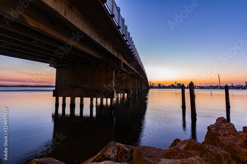 Wallpaper Mural Sun setting over bridge and lake with reflection in water Torontodigital.ca