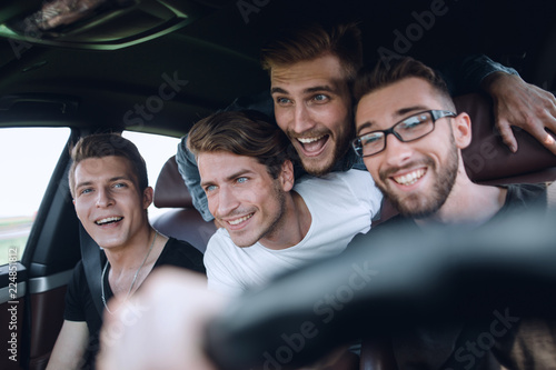 Friends renting a car and driving somewhere