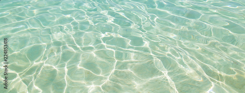 Shining blue water ripple for background. Banner size with copy space.