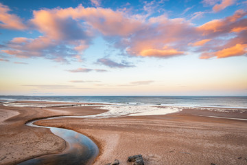 Papier peint photo Pantone 2025 Mocha Mousse Druridge Bay and Dunbar Burn near sunset / Druridge Bay is a seven mile long beach in Northumberland between Amble to the north and Cresswell to the south  © drhfoto