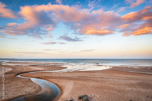 Fototapeta Naklejka Na Ścianę i Meble -  Druridge Bay and Dunbar Burn near sunset / Druridge Bay is a seven mile long beach in Northumberland between Amble to the north and Cresswell to the south