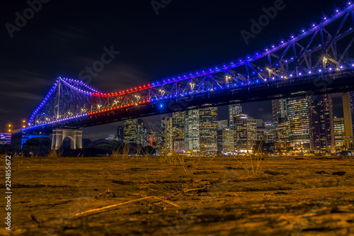 Bright illumination of city bridge in night
