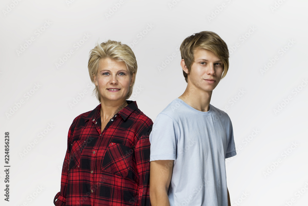Family portrait. Smiling mother and son wearing casual clothing Family portrait. Smiling mother and son wearing casual clothing