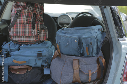 backpacks in a trunk of car