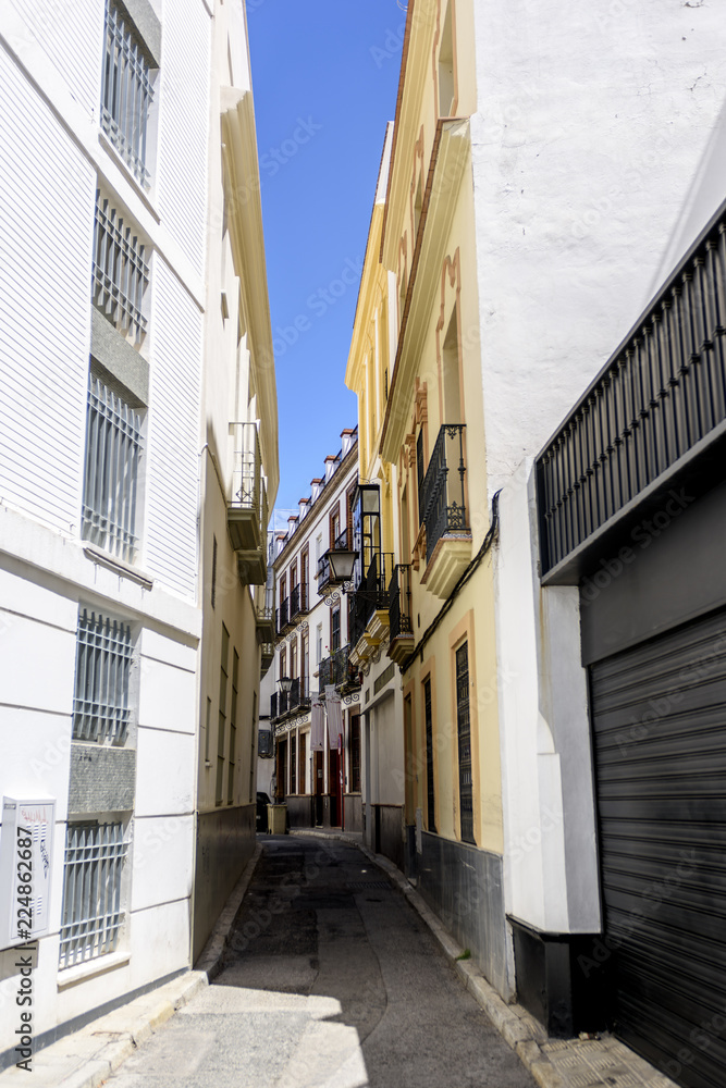 view of a street in an old quarter of Seville, Andalucia, Spain.