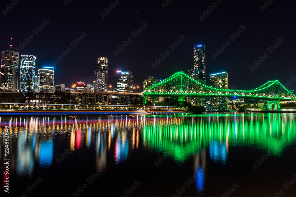 Green illumination of city bridge