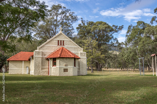 Country stone church in rural landscape setting