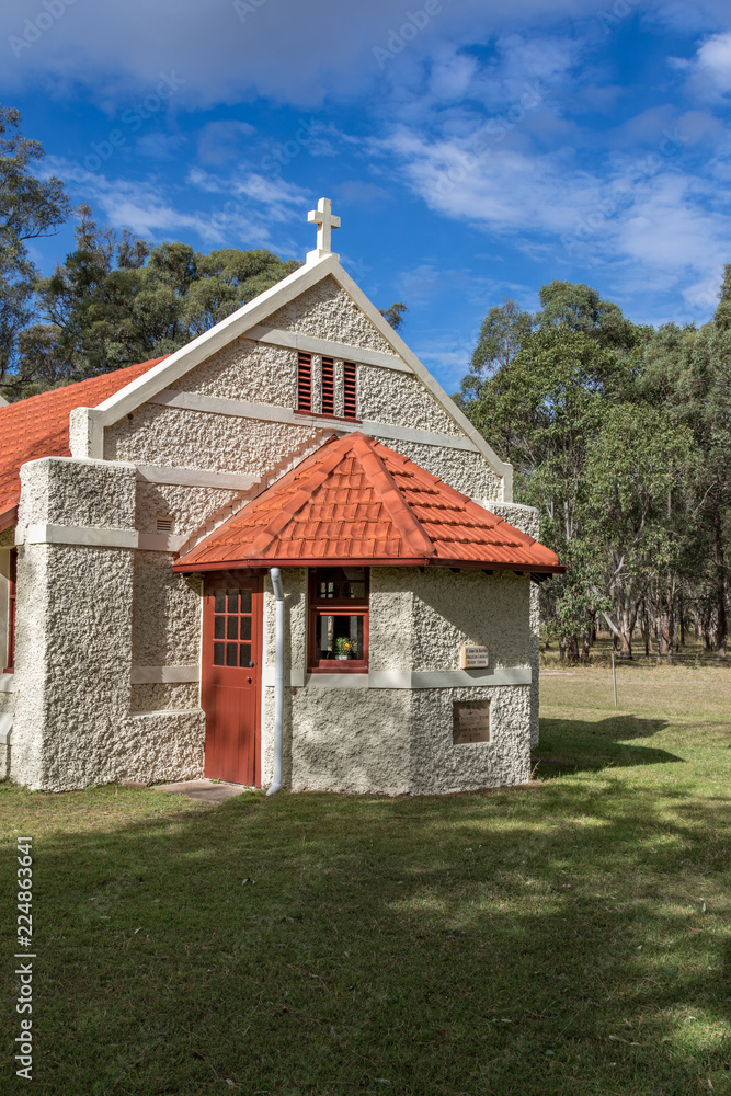 Country stone church in rural landscape setting