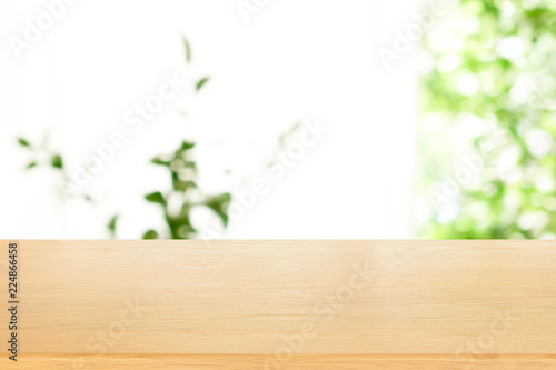 wooden plank table top with blur park green nature background bokeh light , for display or montage of product,Spring and Summer concept
