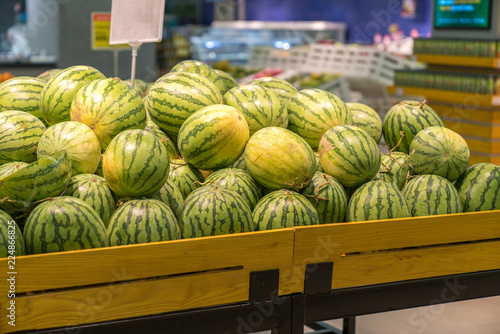 Fresh healthy fruits on shelves in supermarket