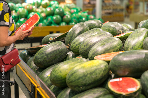Fresh healthy fruits on shelves in supermarket