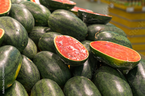 Fresh healthy fruits on shelves in supermarket