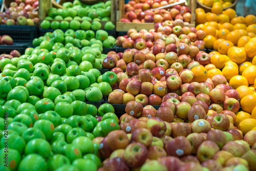 Fresh healthy fruits on shelves in supermarket