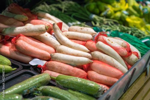 Fresh tropical vegetable on shelves in modern supermarket
