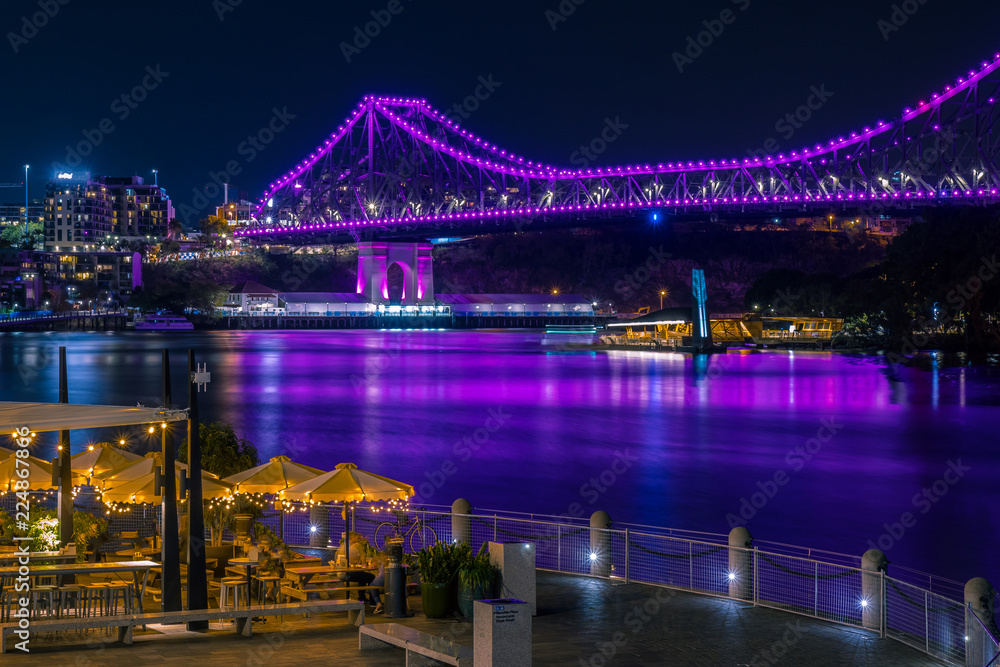 View of glowing bright bridge in night time