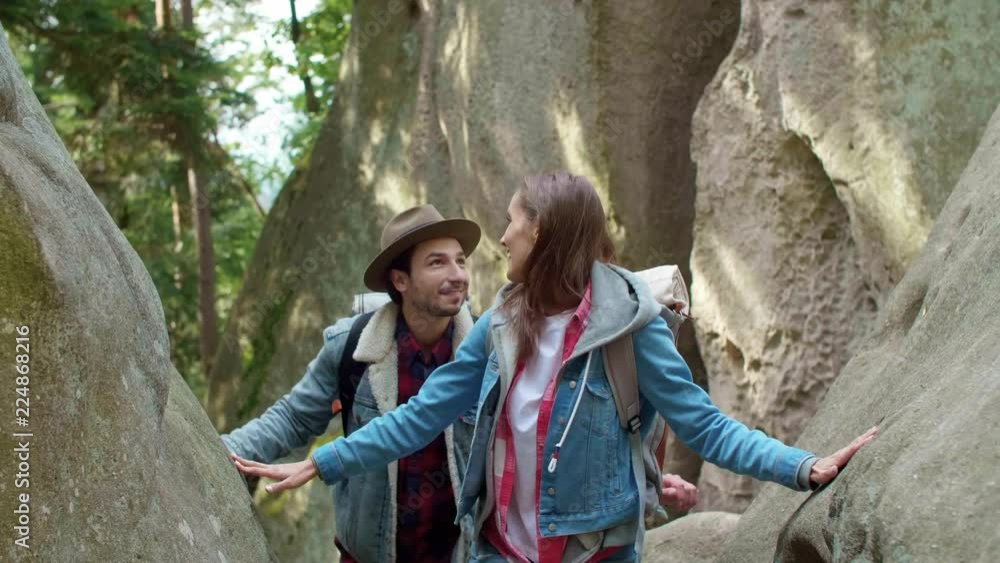 Couple with backpacks during hiking trip Couple with backpacks during hiking trip