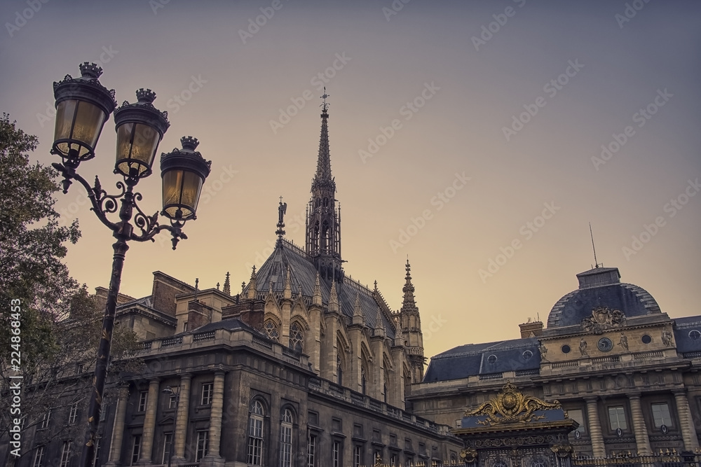 Sainte Chapelle and viewed from the entrance of the court in Paris