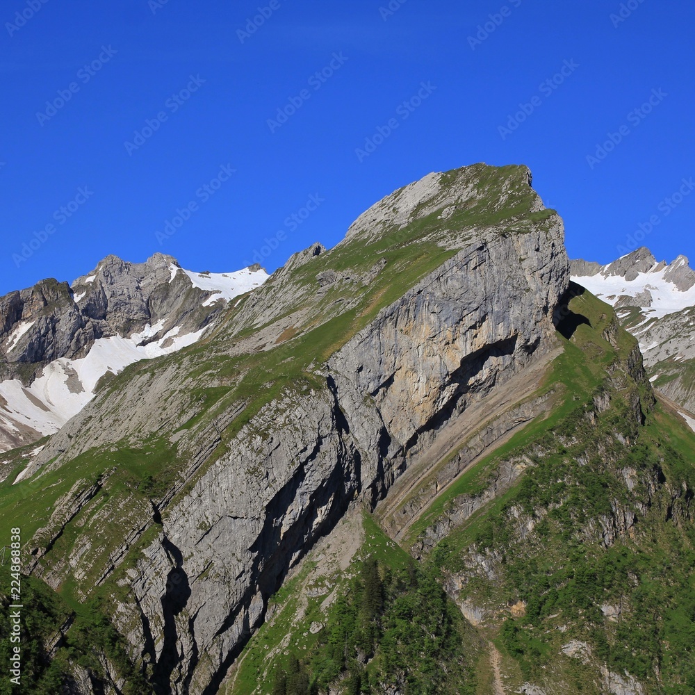 Landscape on the way from Seealp to Meglisalp. Appenzell Canton, Switzerland. Visible rock layers.