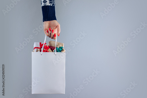 Hand with shopping bag photo