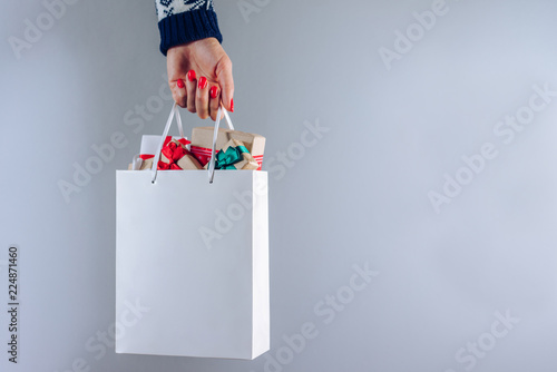 Hand with shopping bag photo