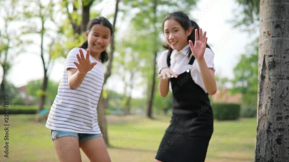 asian teenager playing in public park asian teenager playing in public park