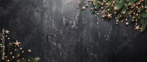 Christmas Decoration With fir Branches on a Dark Shale Backgroun