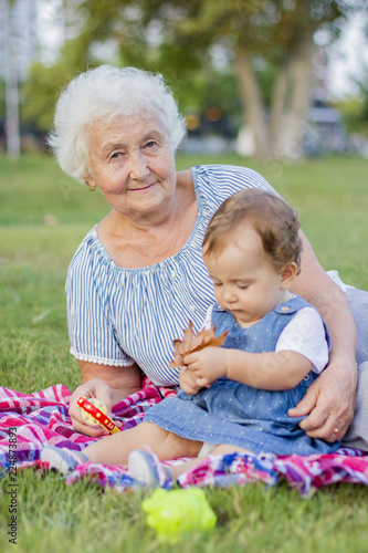 Granddaughter with grandmother in the park